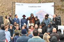 tim smith speaks on a stage in hazelwood green at the announcement event of the new center of life location